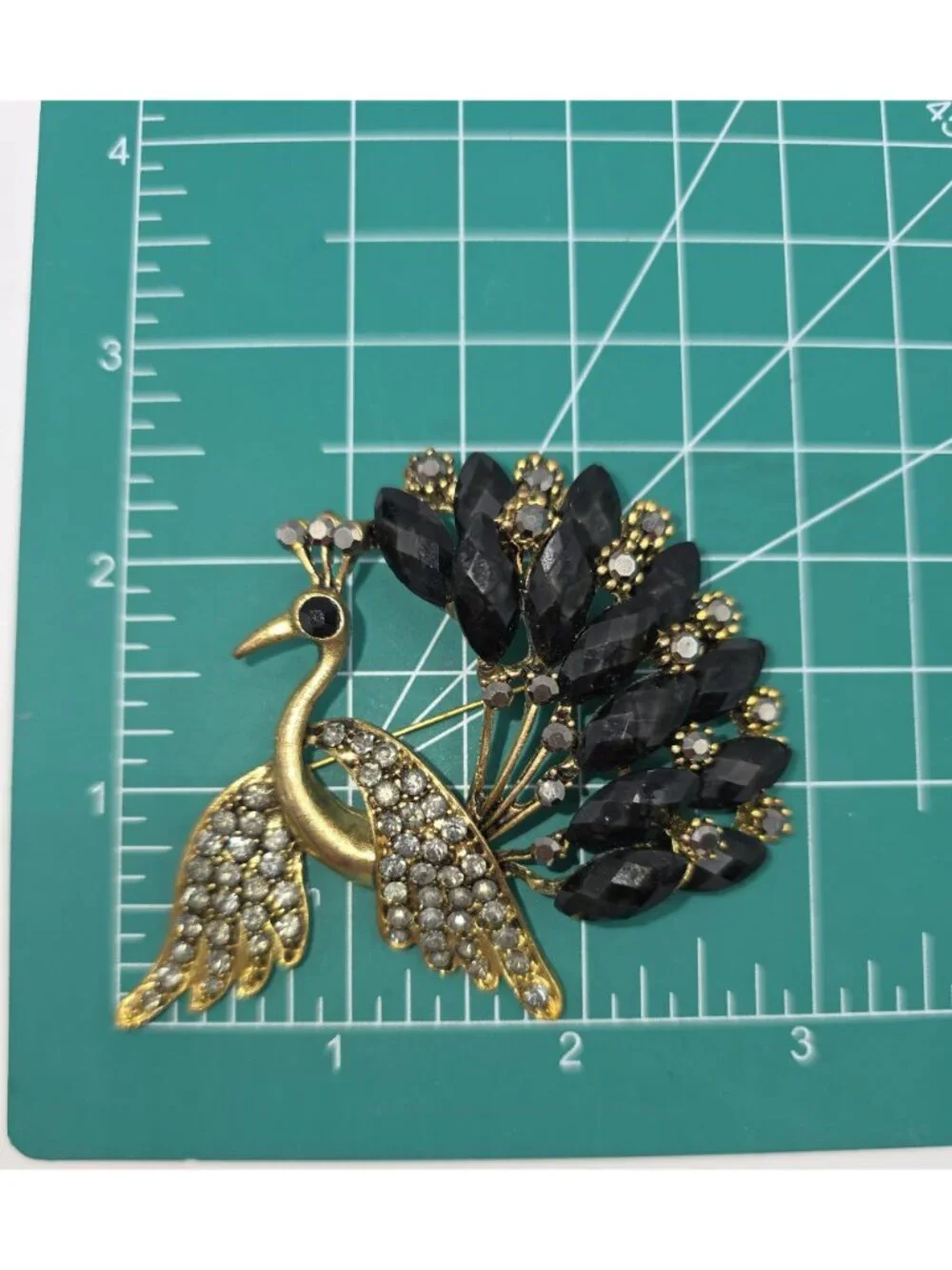 Gold-Tone Peacock Brooch With Rhinestone Wings & Black Gemstone Tail Feathers